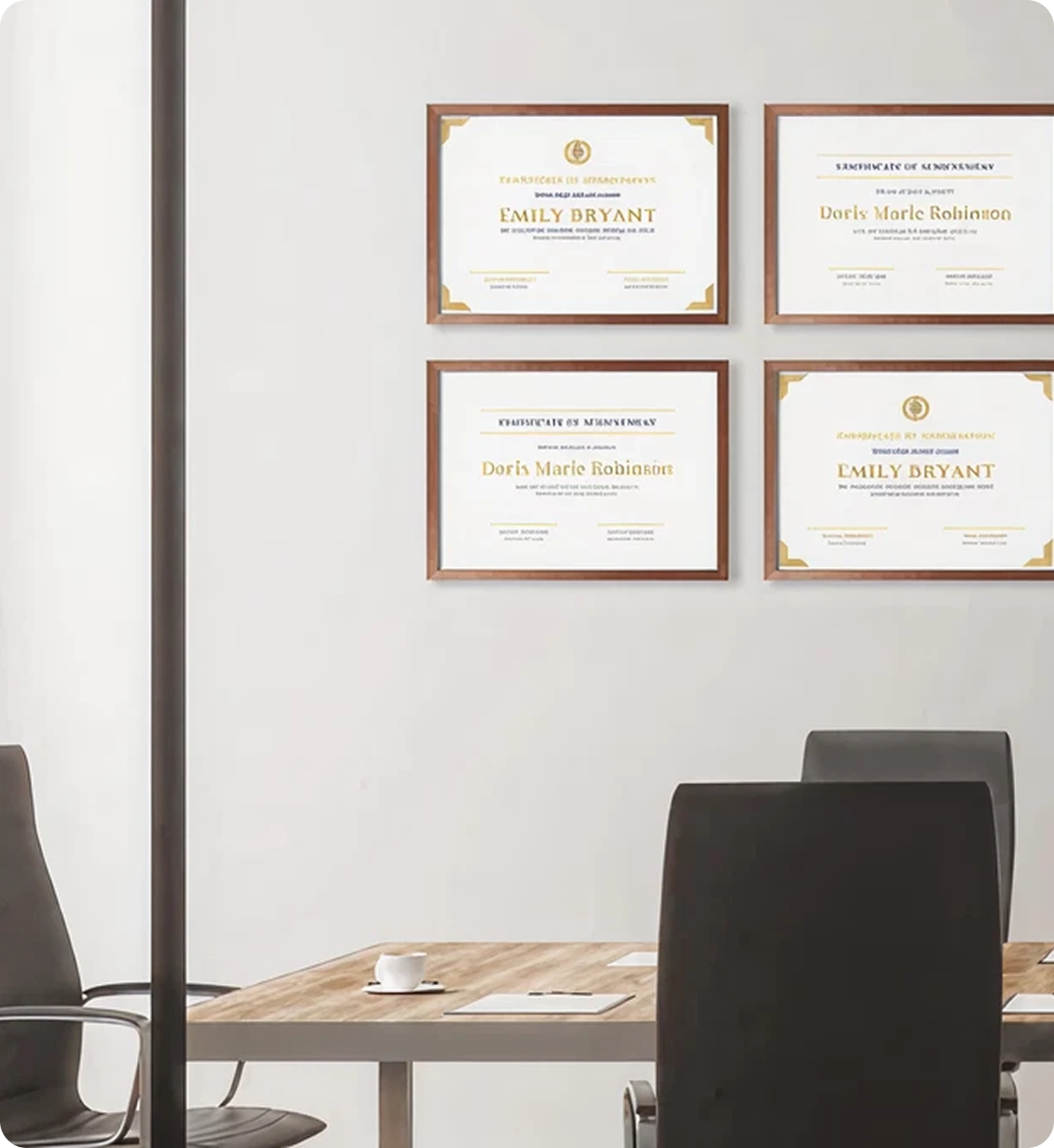 Framed certificates displayed on an office wall